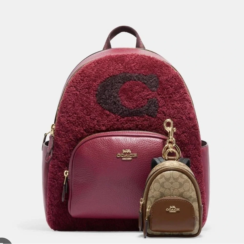 100% Authenti‹ Coach mini backpack charm Brand new with tag. Brown Beige.